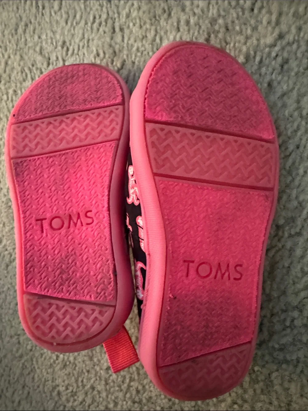 Toms Kids Black Canvas Slip-Ons with Pink Dinosaur Print